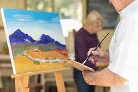 artist painting canvas on an easel will speed up the drying time if he uses a dehumidifier